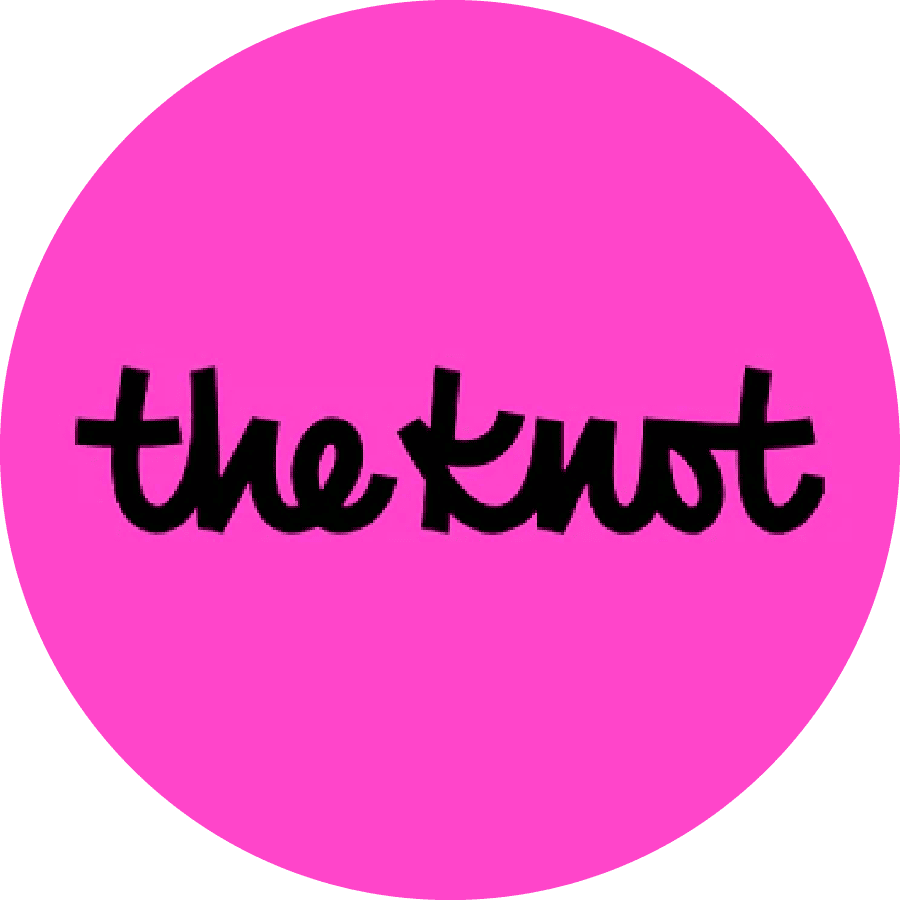A bright magenta circular logo featuring "the knot" text in black handwritten-style font.