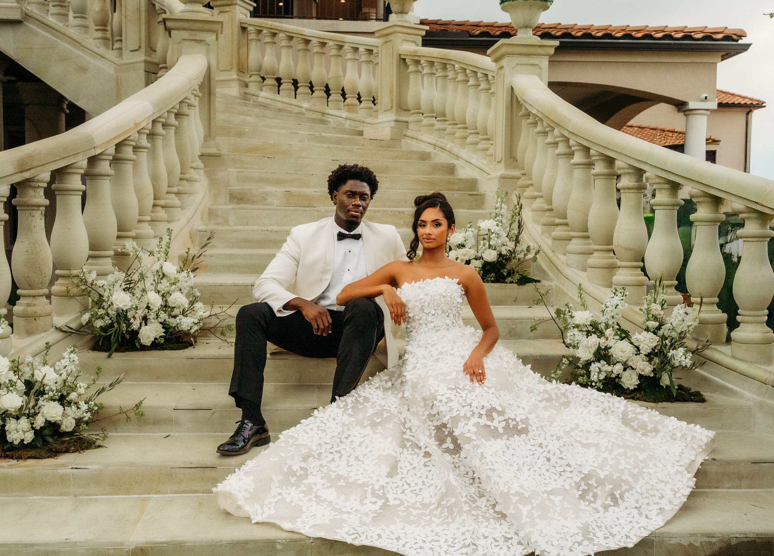 Bride and groom on a grand stone staircase
